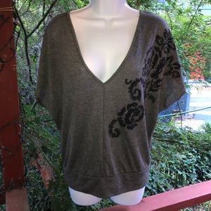 Grey V neck top with open back